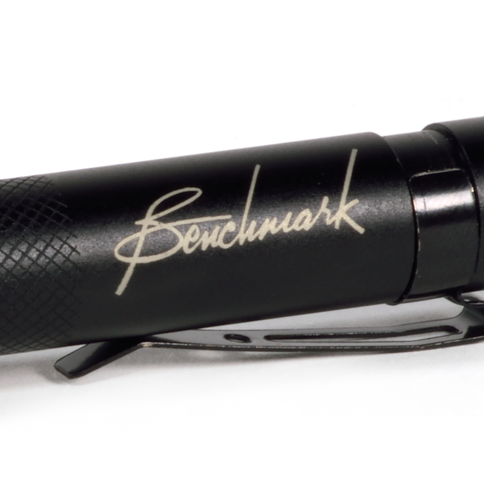 Closeup of laser engraved Benchmark Logo. 